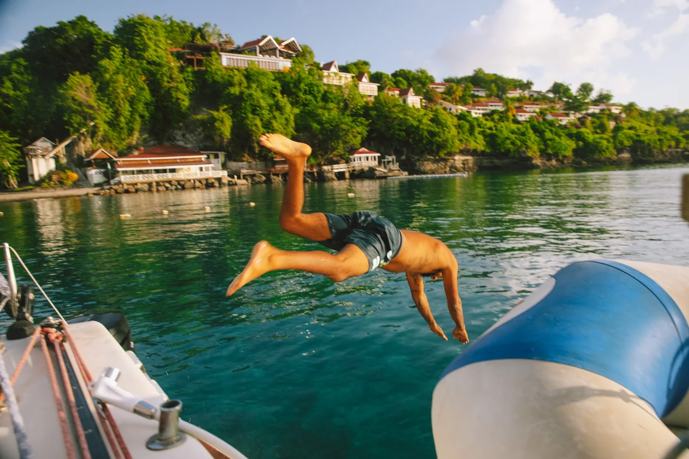 Guest diving from a boat into the sea in St. Lucia
